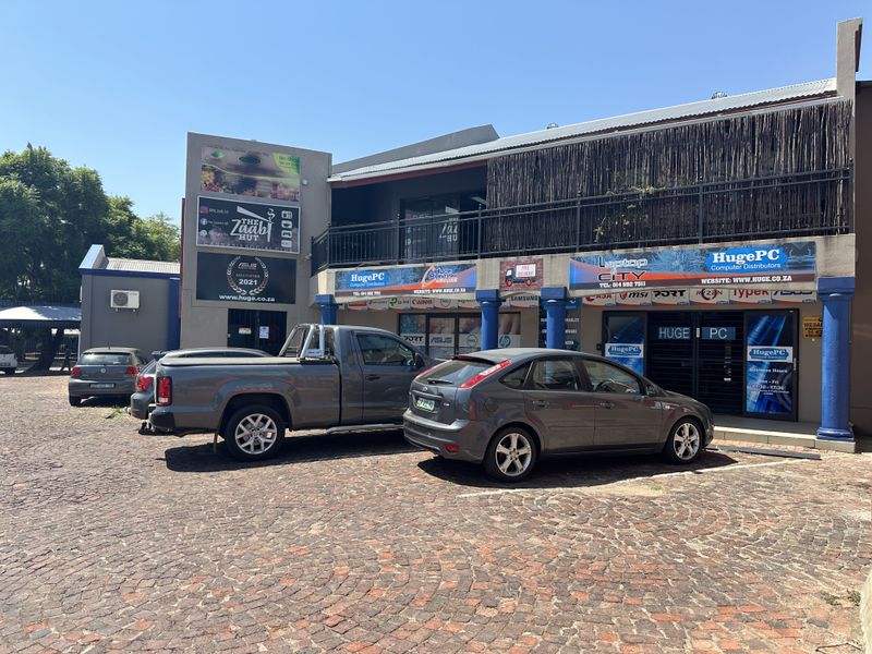 Prime Commercial Investment Opportunity: Four Retail Spaces on a bustling street! - Photo 1