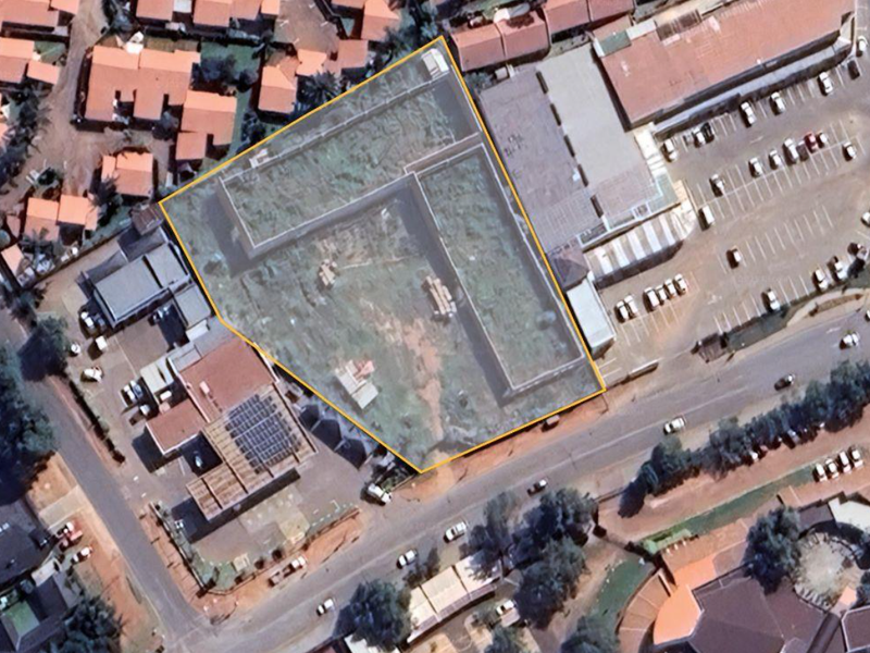 Aerial view of the commercial property site, highlighting the plot boundaries and surrounding infrastructure within the urban context.