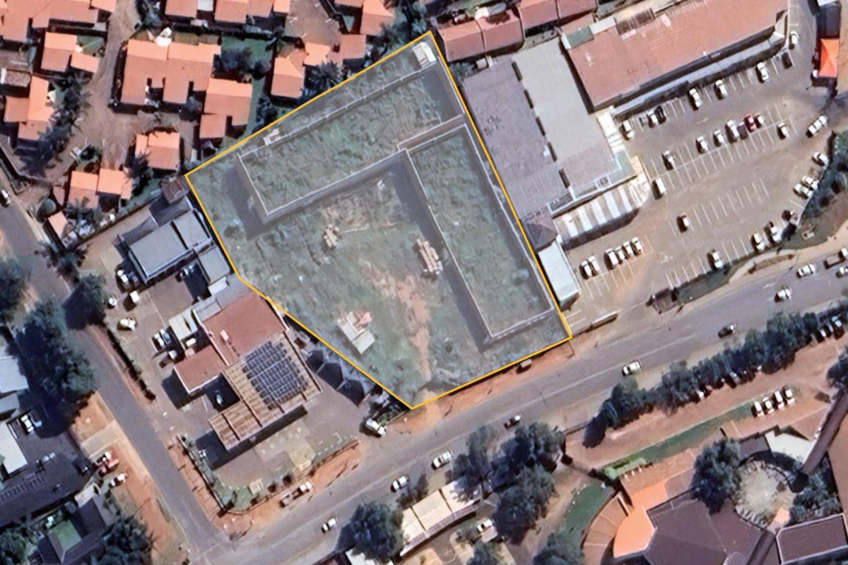 Aerial view of the commercial property site, highlighting the plot boundaries and surrounding infrastructure within the urban context.