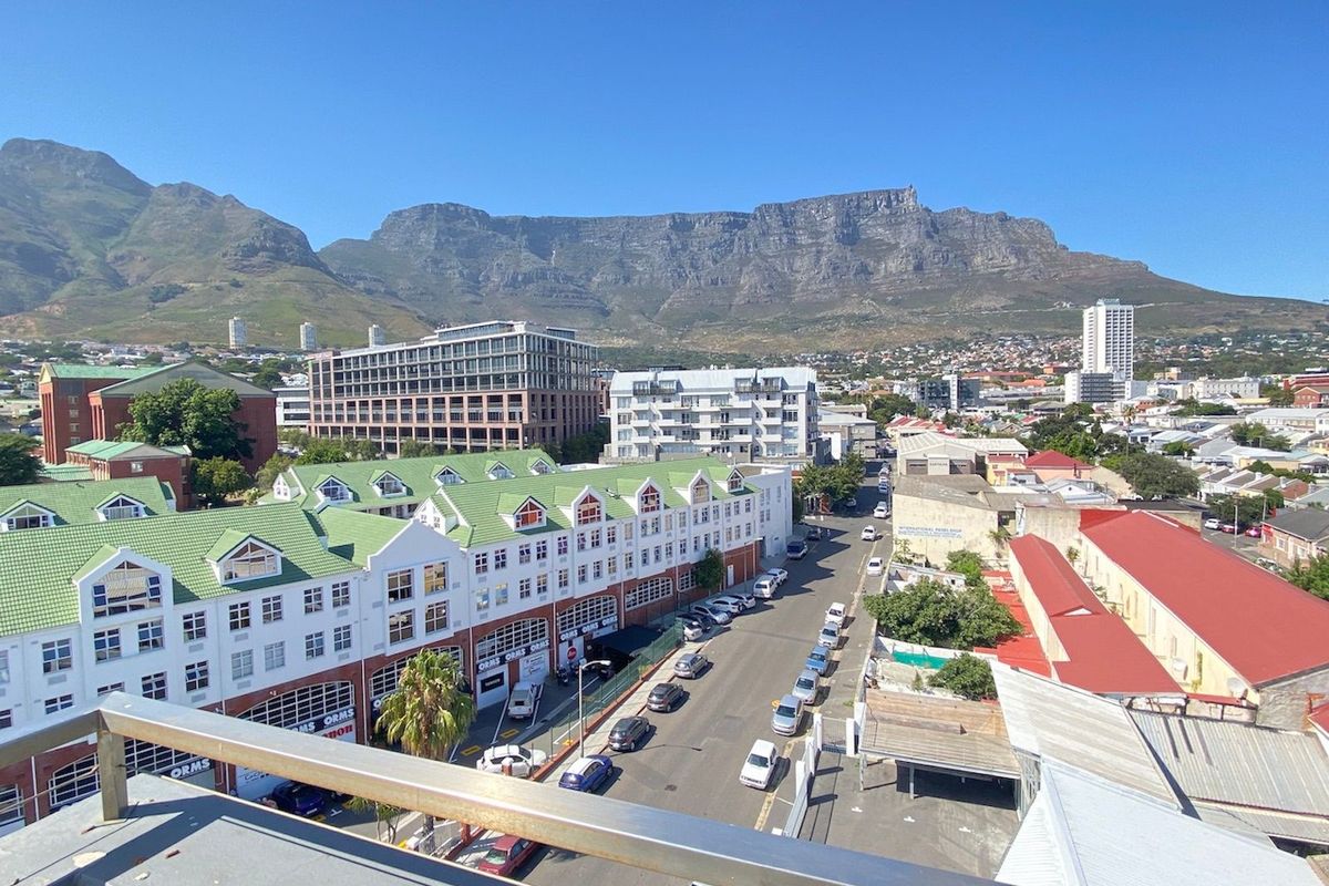 Elevated aerial view overlooking the surrounding urban neighborhood with Table Mountain in the background.