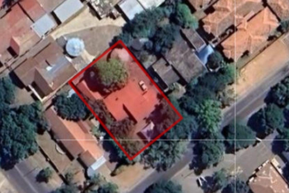 An aerial satellite view showing the property boundary and surrounding neighborhood layout.