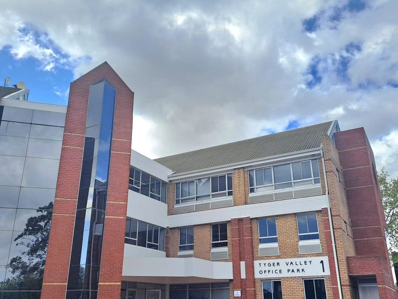 Front elevation of Tyger Valley Office Park building featuring a combination of brickwork, glass curtain walling, and modern architectural design.