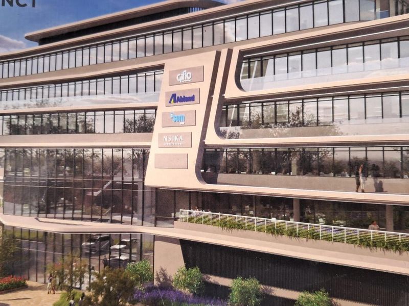 A modern multi-story office building featuring contemporary architectural design, glass curtain walls, and integrated corporate signage.