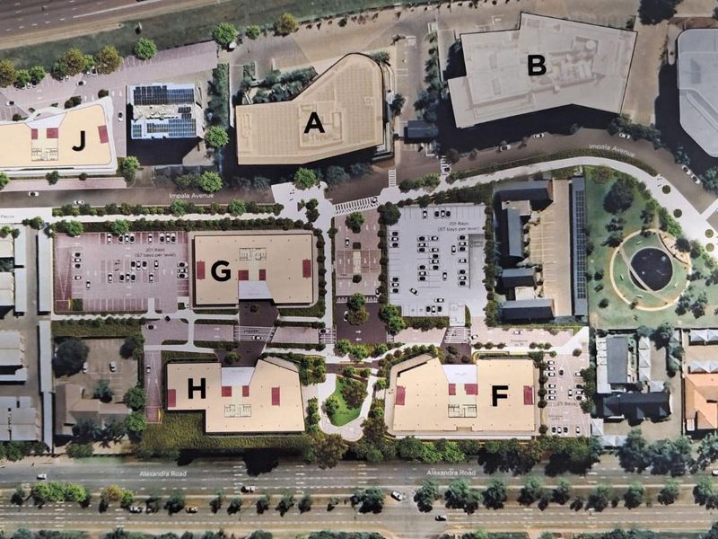 An aerial site plan showing the layout of the office park, including multiple buildings, parking areas, and landscaped grounds.