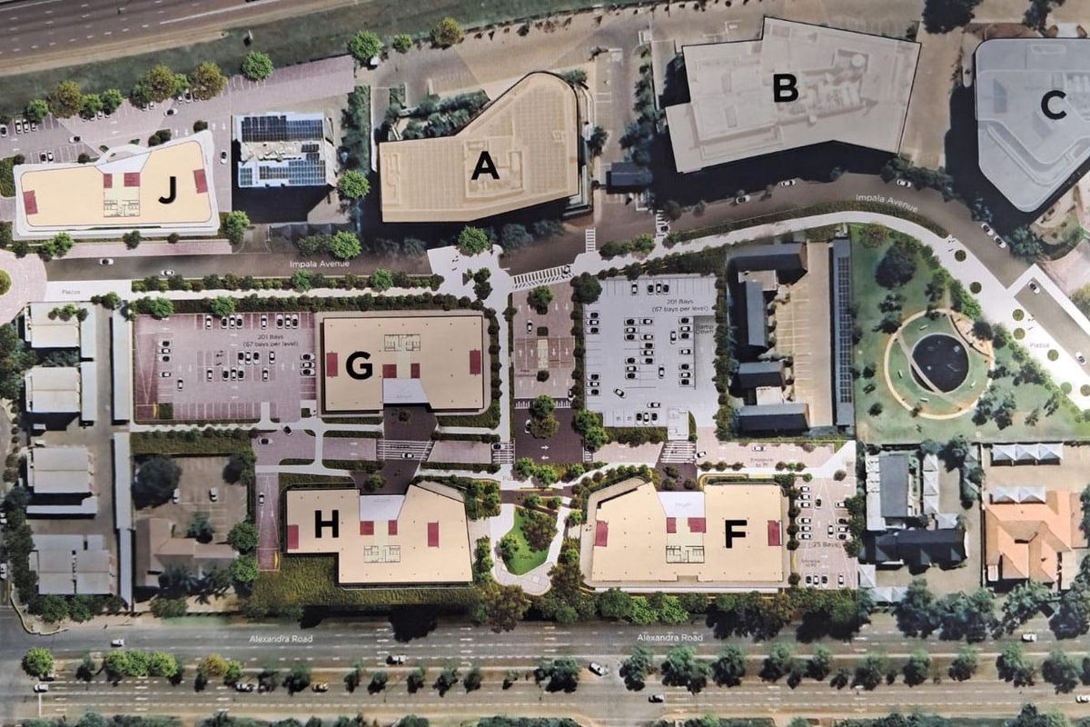 An aerial site plan showing the layout of the office park, including multiple buildings, parking areas, and landscaped grounds.