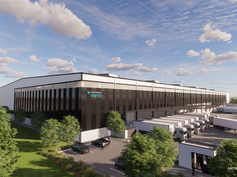 A modern industrial logistics facility featuring extensive loading docks, professional cladding, and a dedicated security gatehouse within a landscaped site.