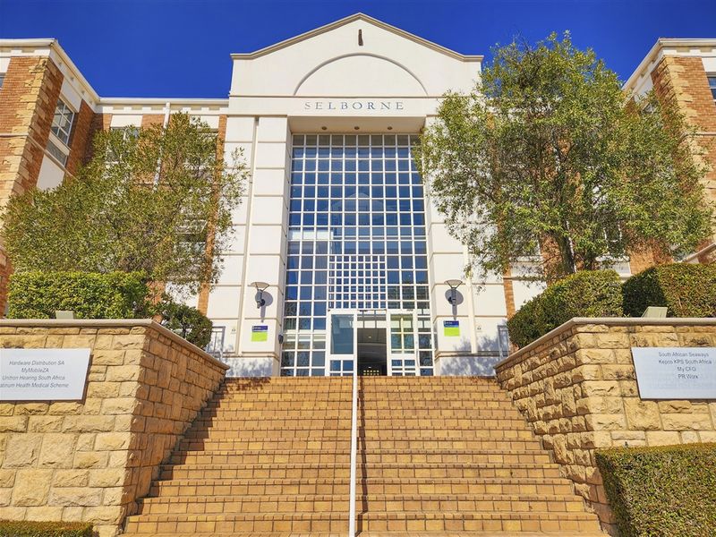 Front elevation of the Selborne office building featuring a prominent stone staircase, glass facade, and professional signage.