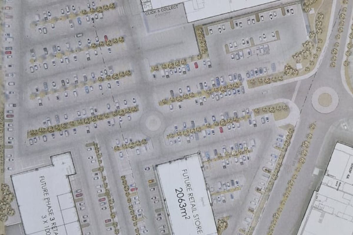 A detailed site plan showing the layout of the retail development, including existing store footprints, parking areas, and future expansion phases.