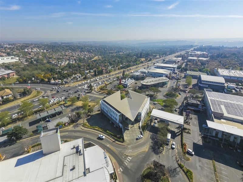 Aerial view of the commercial office property showing its location, surrounding road infrastructure, and access points within the business district.