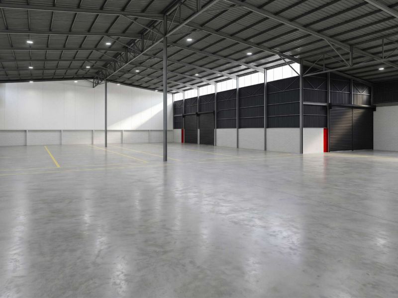 Spacious industrial warehouse featuring high ceilings, concrete flooring, roller shutter access, and modern LED lighting, suitable for various commercial or storage operations.