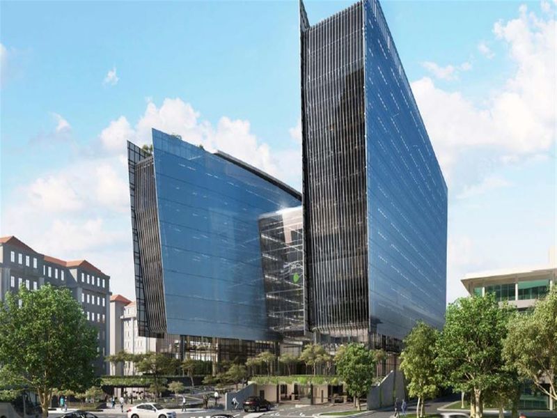 A modern, high-rise office complex featuring a striking glass curtain wall design and integrated landscaped plaza area.