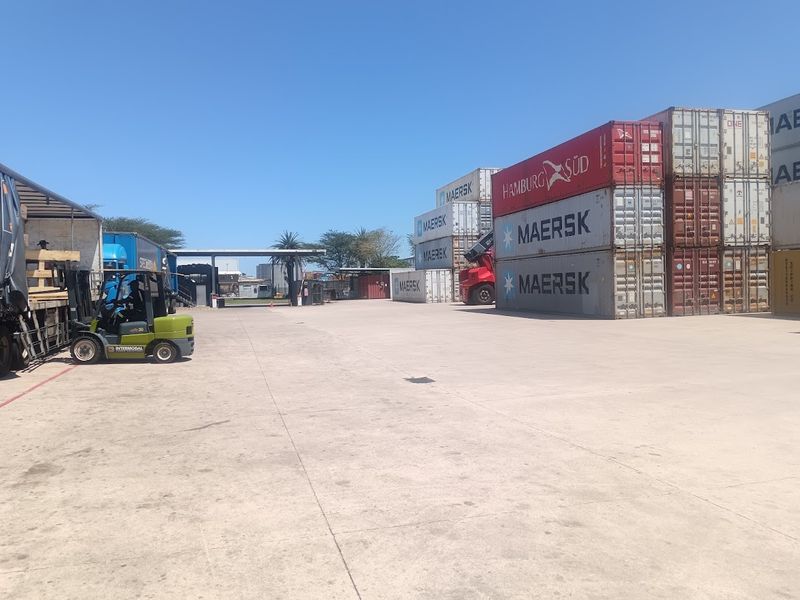 Industrial yard space featuring a large concrete surface area suitable for logistics, storage, and heavy vehicle maneuvering.
