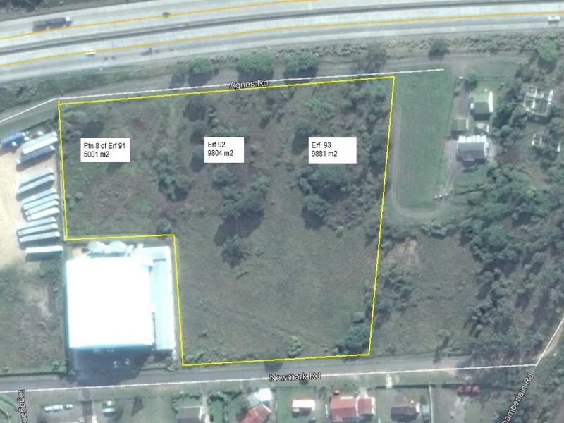 Aerial view of vacant commercial land parcels located between Agnes Road and Newmark Road, showing site boundaries and surrounding infrastructure.
