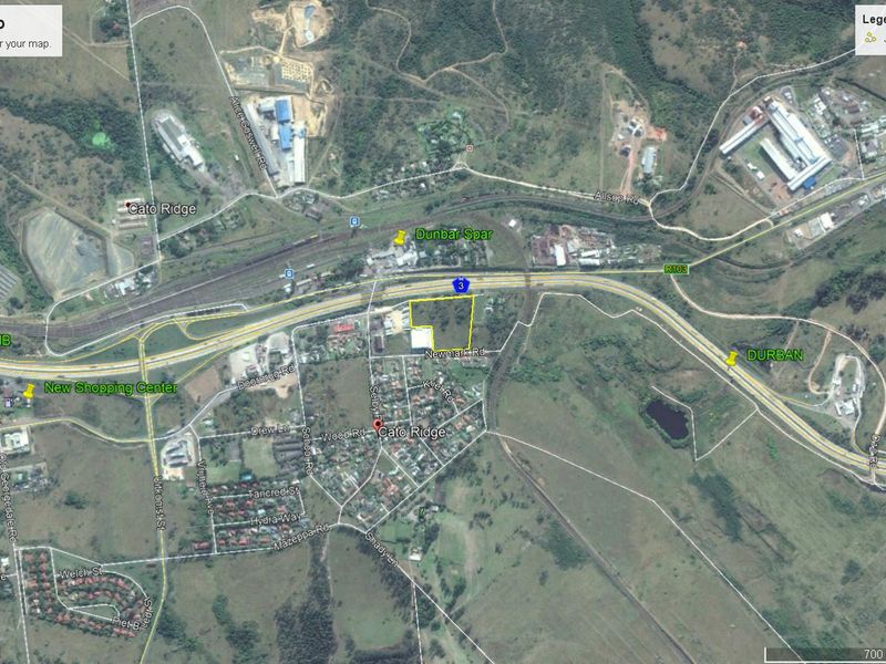 Aerial view of a vacant commercial land parcel in Cato Ridge, highlighting its strategic location near major transport routes and local infrastructure.