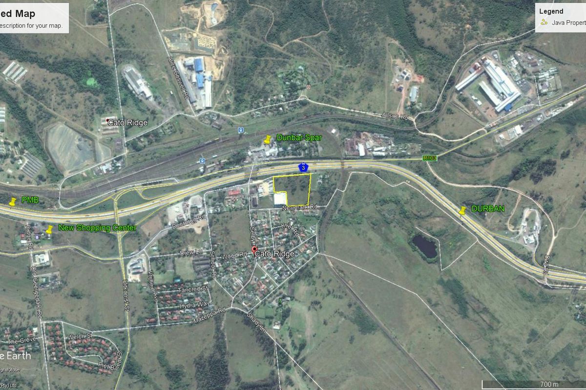Aerial view of a vacant commercial land parcel in Cato Ridge, highlighting its strategic location near major transport routes and local infrastructure.
