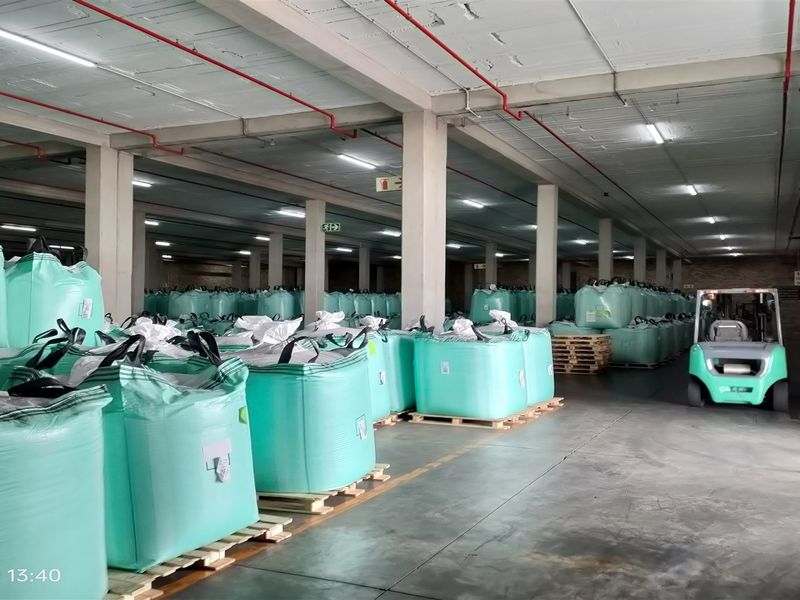Spacious industrial warehouse facility featuring high ceilings, concrete flooring, exposed fire suppression systems, and large roller shutter access.