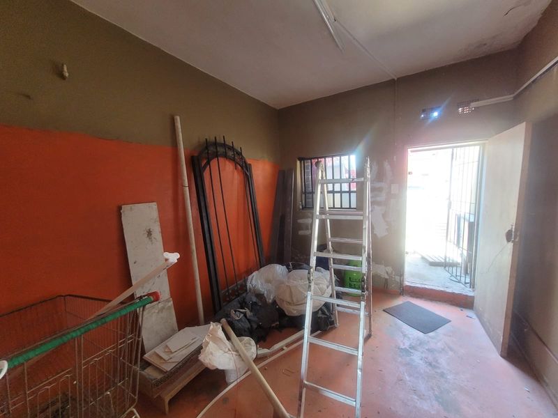 Versatile Commercial Property with Dual Stores and On-Site Accommodation - Photo 10