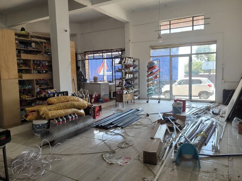 Versatile Commercial Property with Dual Stores and On-Site Accommodation - Photo 9