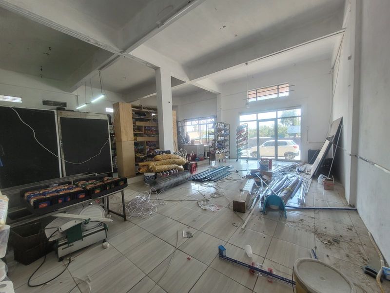 Versatile Commercial Property with Dual Stores and On-Site Accommodation - Photo 8