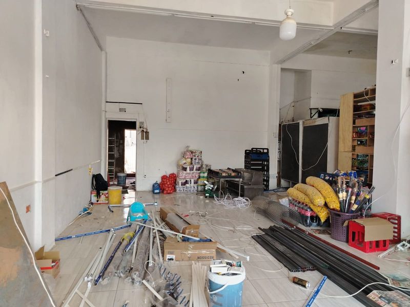 Versatile Commercial Property with Dual Stores and On-Site Accommodation - Photo 7