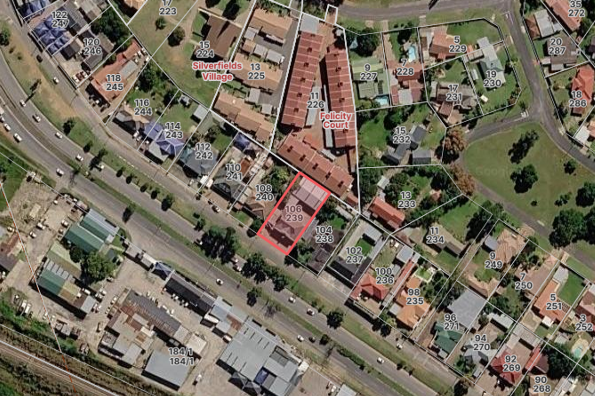 An aerial satellite view showing the property location and surrounding industrial and residential neighborhood layout.