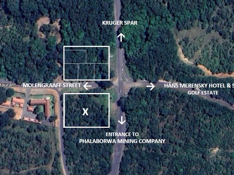 Aerial view of vacant commercial land parcels located near key local landmarks and major road access points.