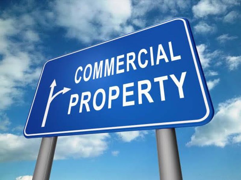 A generic sign indicating commercial property, not an actual image of a real estate asset.