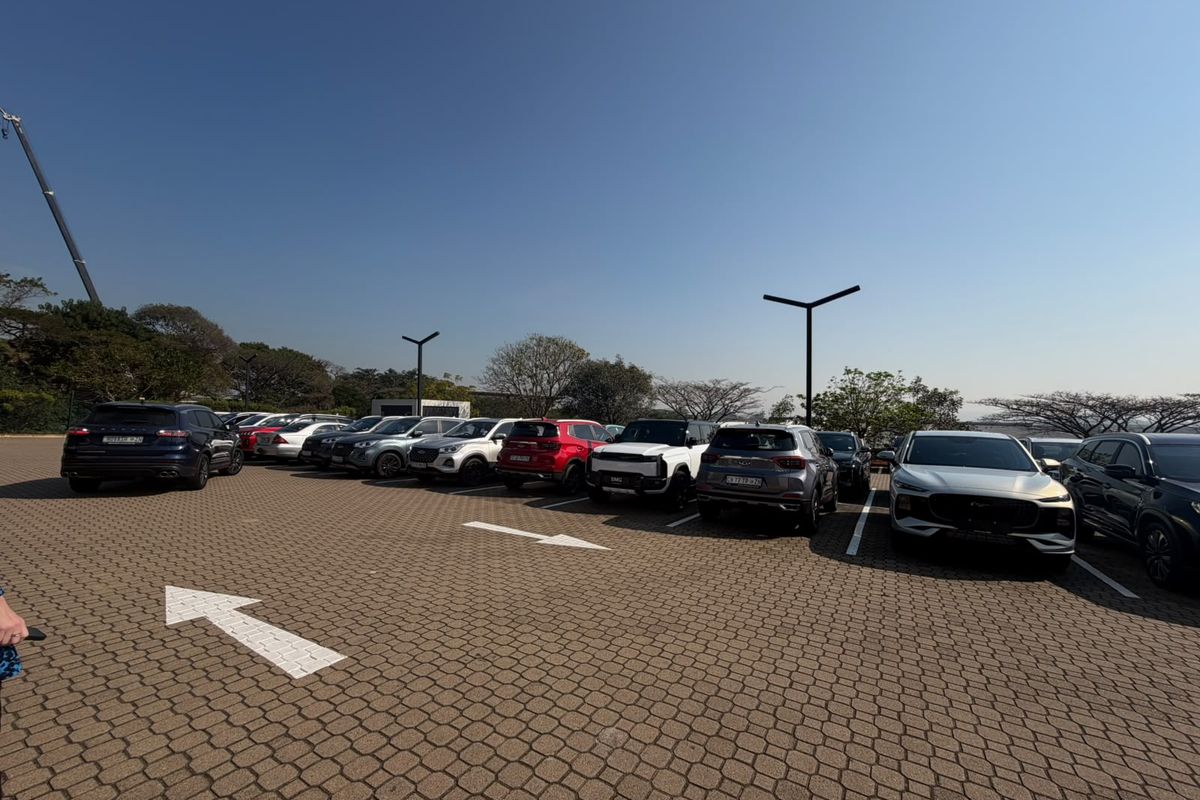 A well-maintained paved parking area featuring clearly marked bays and modern pole-mounted lighting, suitable for retail customer or staff parking.