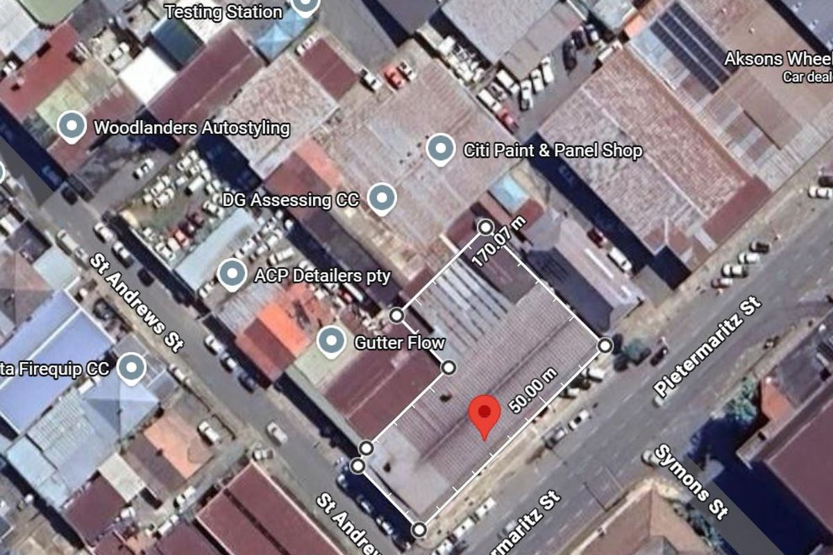 Aerial view of an industrial property site showing the building footprint and surrounding street layout in a commercial district.
