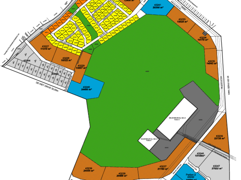 A detailed site layout plan showing multiple commercial land parcels, road access, and designated zones for the development.