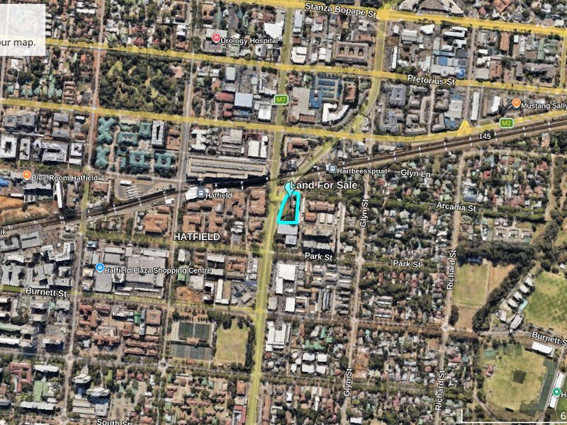Aerial view of a vacant commercial land plot located in the Hatfield area, highlighting its position within the surrounding urban infrastructure and road network.