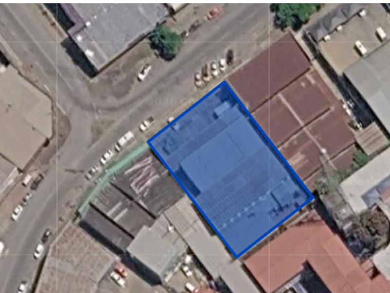 Aerial view of the industrial property site highlighting the building footprint and surrounding street access.