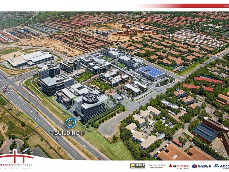 Aerial view of Hertford Office Park, showcasing the modern office buildings, landscaped grounds, and surrounding road infrastructure in a professional business park setting.
