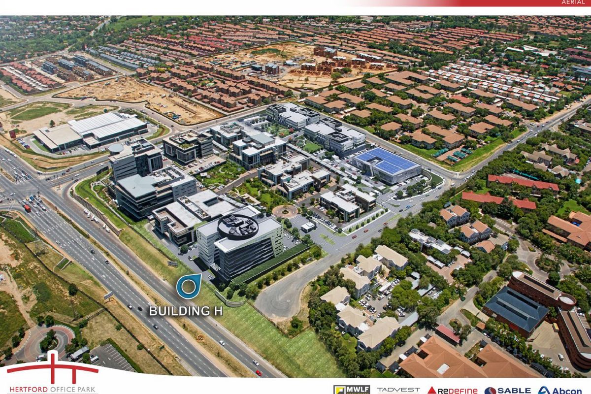 Aerial view of Hertford Office Park, showcasing the modern office buildings, landscaped grounds, and surrounding road infrastructure in a professional business park setting.