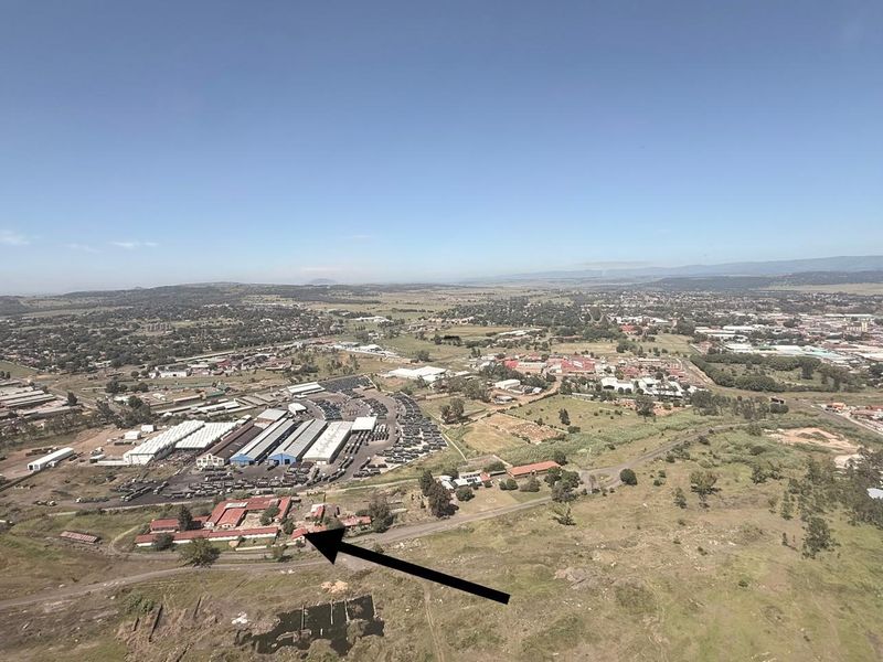 Aerial view of the industrial property site, highlighting the main facility buildings and surrounding landscape.