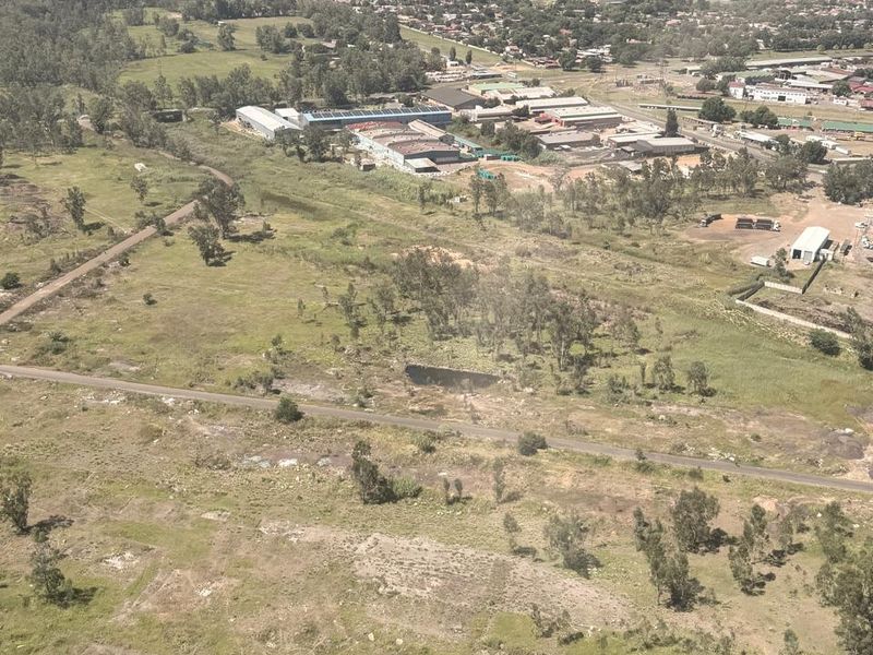 Aerial view of the industrial property site, showcasing the surrounding landscape, access roads, and proximity to existing industrial infrastructure.