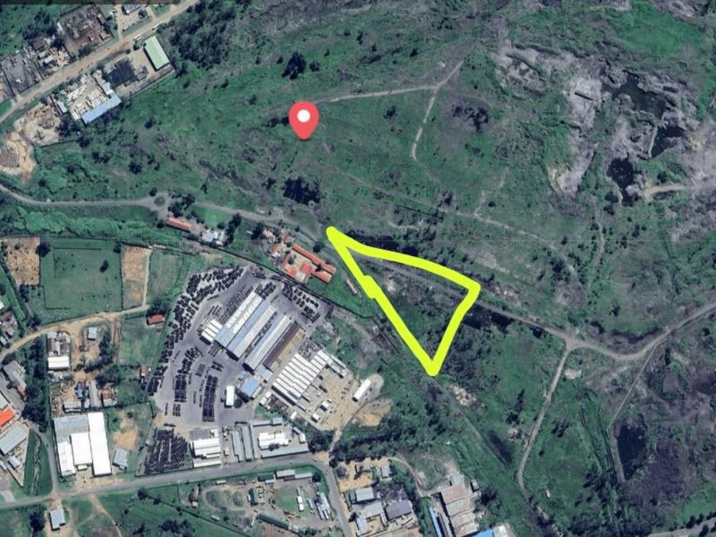 Aerial view of the industrial property site, highlighting the location and surrounding landscape features.