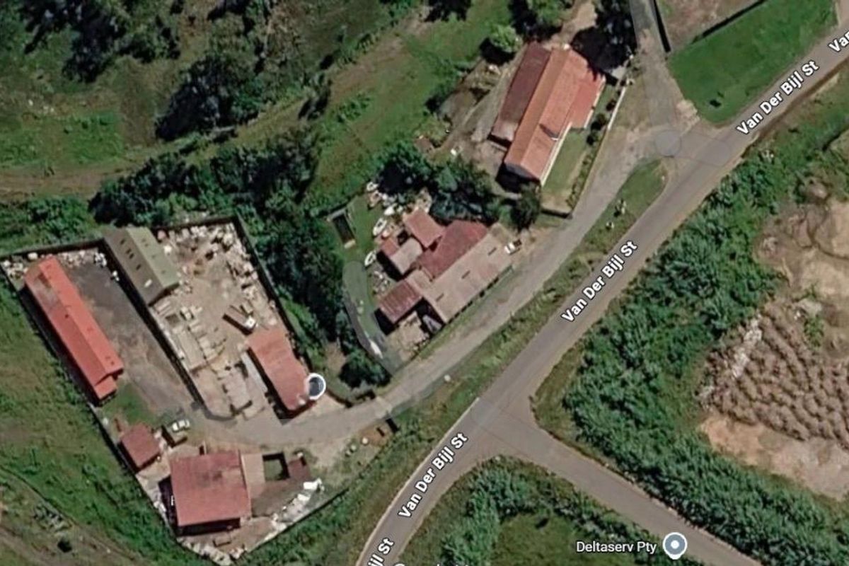 Aerial view of an industrial property featuring multiple sheds, a paved yard area, and direct access from Van Der Bijl Street.