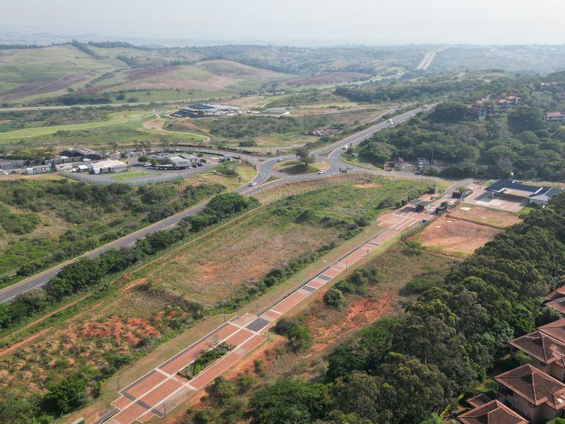 Aerial view of the commercial vacant land parcel, showcasing its strategic location, access roads, and proximity to existing infrastructure and surrounding developments.