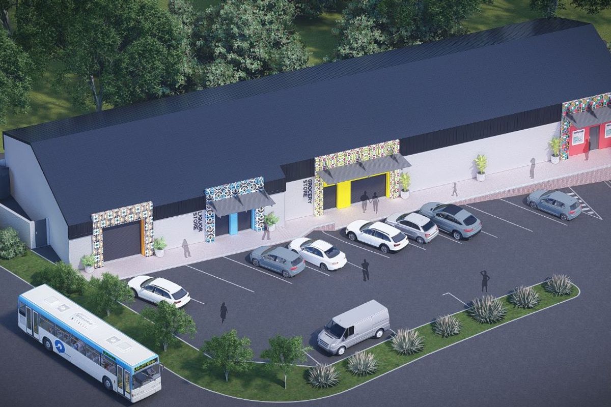 Aerial view of a commercial retail center featuring multiple storefronts, dedicated parking bays, and modern architectural design elements.