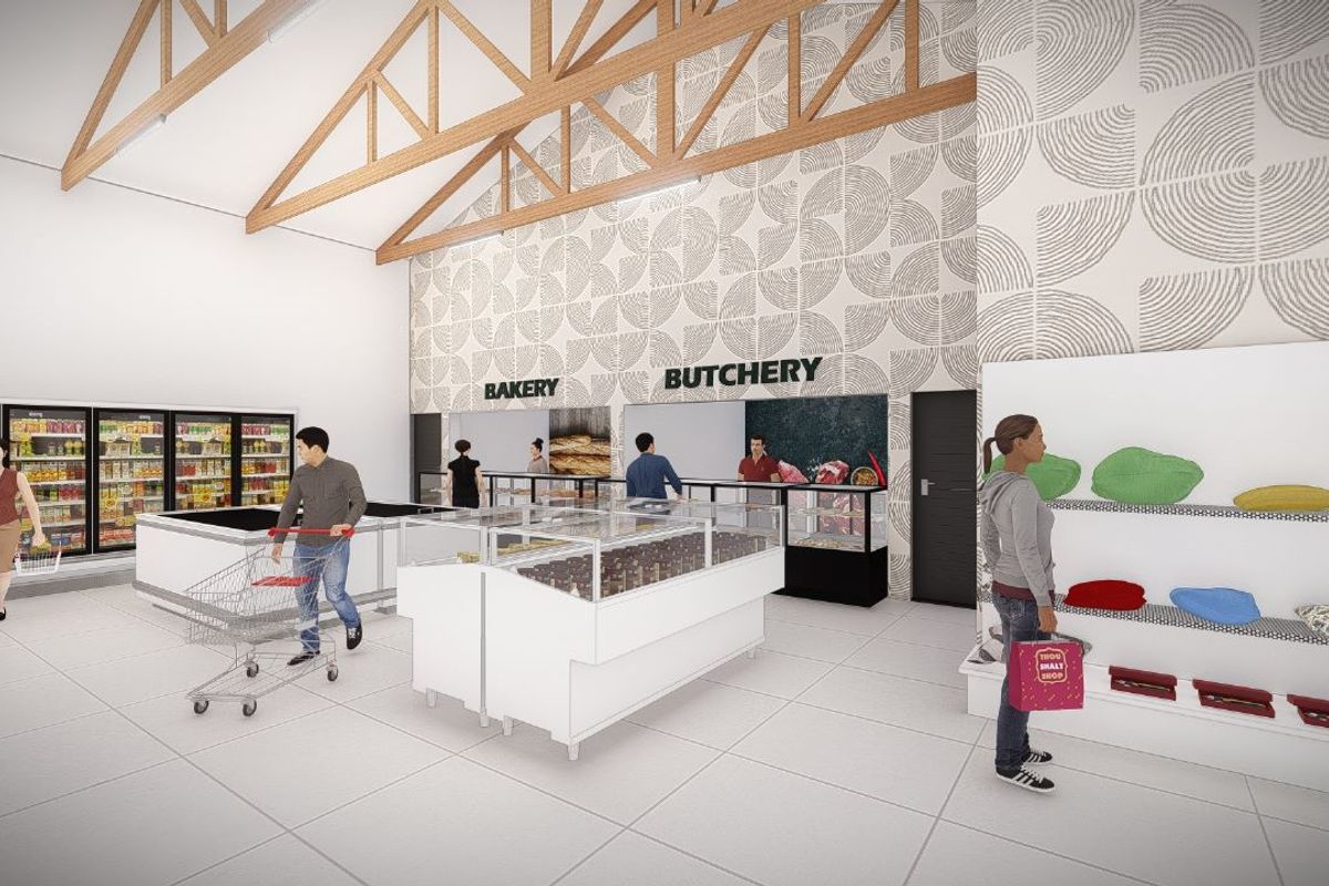 A modern commercial retail space featuring exposed timber roof trusses, tiled flooring, and dedicated bakery and butchery service counters with refrigerated display units.
