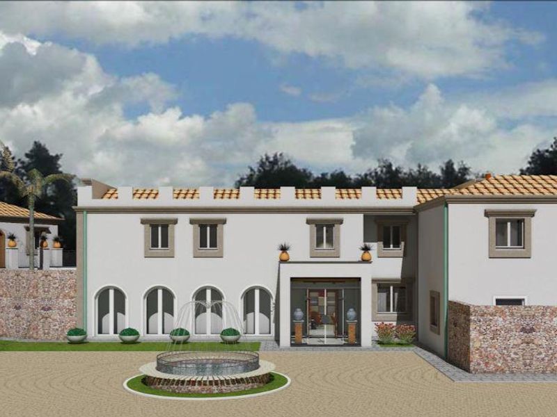 A digital architectural rendering of a Mediterranean-style villa featuring stone masonry, arched windows, a central fountain, and a spacious paved courtyard.