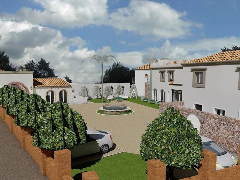 A 3D architectural rendering of a property exterior featuring a paved courtyard, central fountain, and Mediterranean-style building facades with tiled roofing.