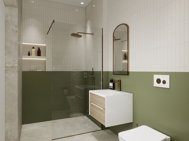 Modern bathroom featuring a walk-in shower with rain head, wall-hung vanity, and contemporary green and white tiled finishes.