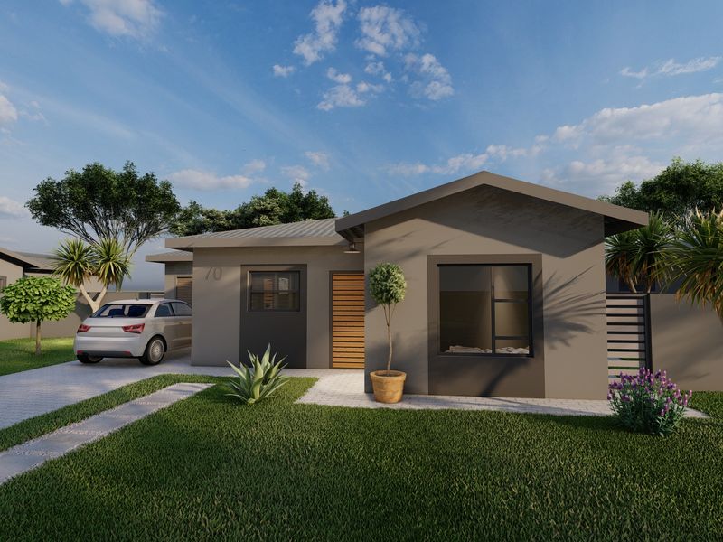 Modern single-story residential home featuring a paved driveway, landscaped front garden, and contemporary grey facade with timber entrance detailing.
