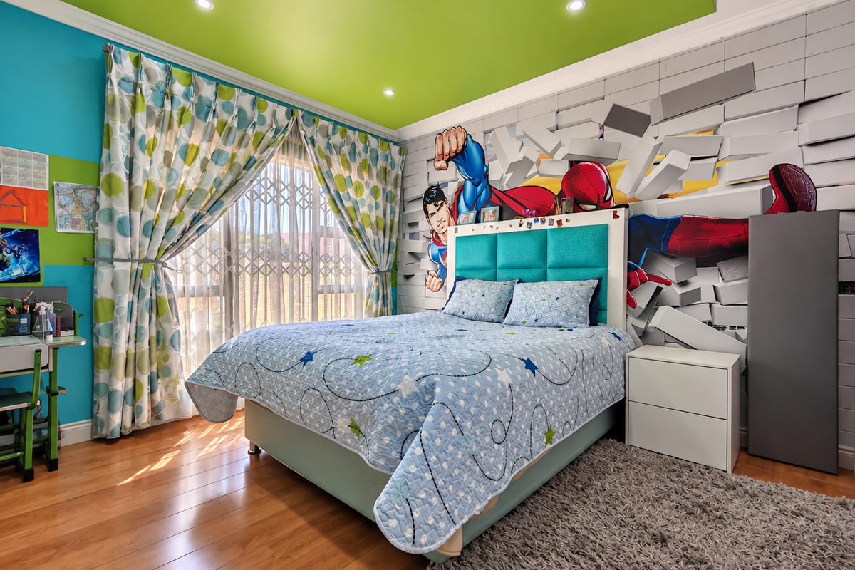 A vibrant bedroom featuring laminate flooring, recessed lighting, and a sliding door with a security gate, offering a bright and functional living space.