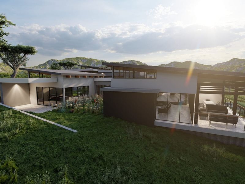 Modern architectural rear elevation featuring a skillion roof, expansive glass windows, and a covered patio overlooking a scenic landscape.