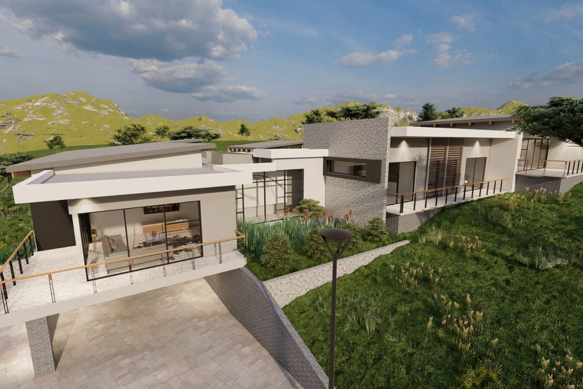 Aerial view of a modern architectural house design featuring stone cladding, expansive balconies, and a paved driveway set in a landscaped environment.