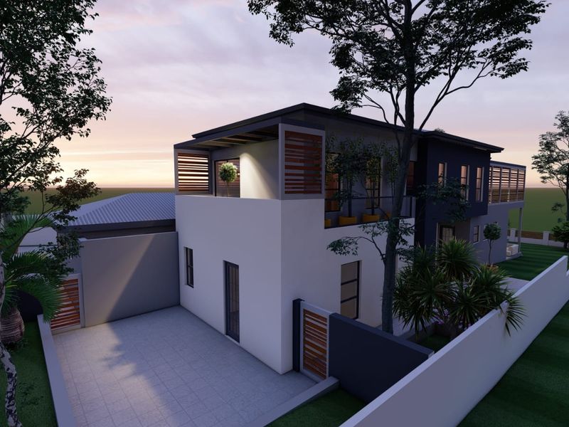 A modern two-story residential property featuring a paved driveway, boundary walls, and an upper-level balcony with timber slat detailing.