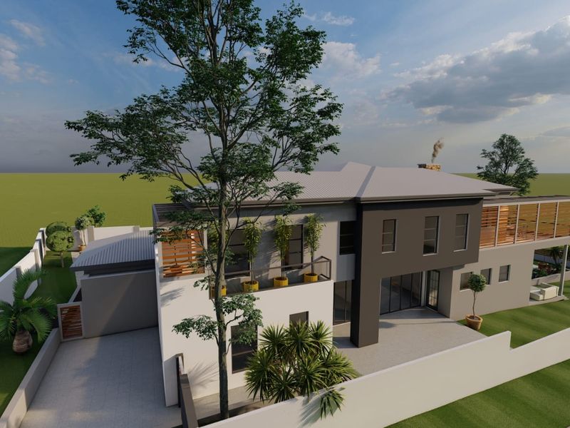 An aerial perspective of a modern two-story residential property featuring a pitched roof, balcony, and landscaped grounds with a perimeter wall.